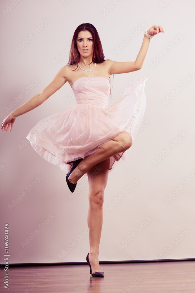 woman in bright dress and high heels shoes dancing woman in bright dress and high heels shoes dancing