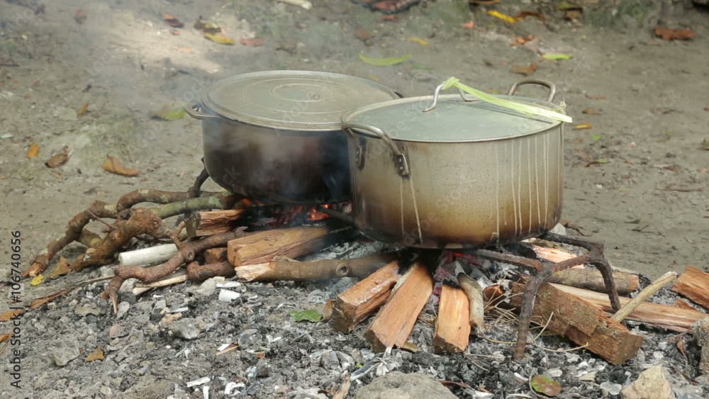 Cooking pots boiling lobster on beach, Champagne Bay, Vanuatu Cooking pots boiling lobster on beach, Champagne Bay, Vanuatu