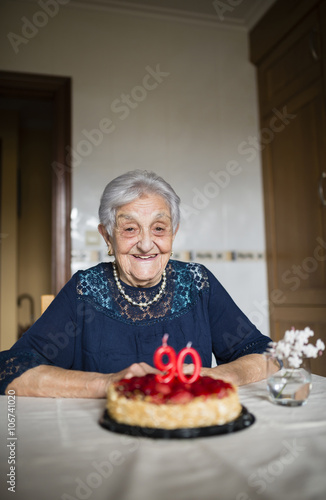 Portrait of happy senior woman celebrating her ninetieth birthday photo