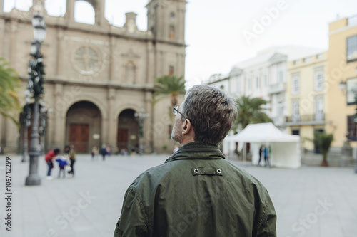 Spain, Canary Islands, Gran Canaria, Las Palmas, man looking at Catedral de Santa Ana photo