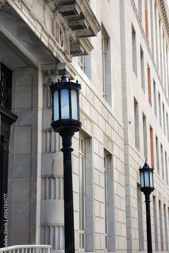 street lamps in front of ancient building street lamps in front of ancient building