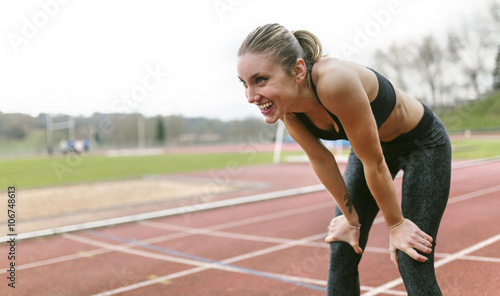 Athlete woman recovering after training photo