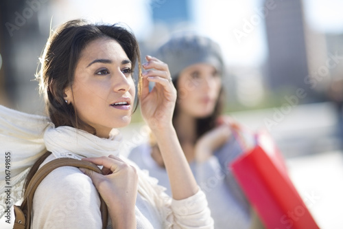 Portrait of surprised woman with white scarf photo