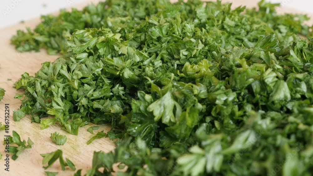 Green healthy vegetable parsley cutting on smaller pieces 4K 3840X2160 UltraHD footage - Petroselinum crispum plant on cutting board 4K 2160p UHD video Green healthy vegetable parsley cutting on smaller pieces 4K 3840X2160 UltraHD footage - Petroselinum crispum plant on cutting board 4K 2160p UHD video