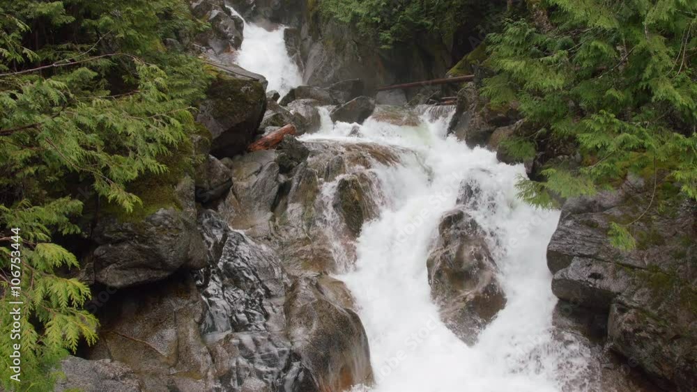 Jib Crane Shot Up of Rain Falling on Waterfall in Pacific Northwest Forest Jib Crane Shot Up of Rain Falling on Waterfall in Pacific Northwest Forest