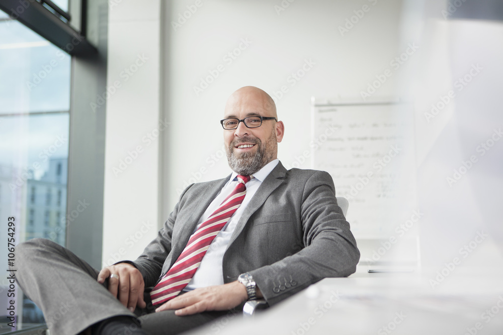 Portrait of confident businessman in office Portrait of confident businessman in office