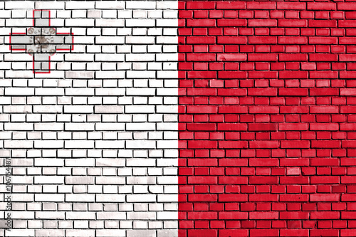 flag of Malta painted on brick wall