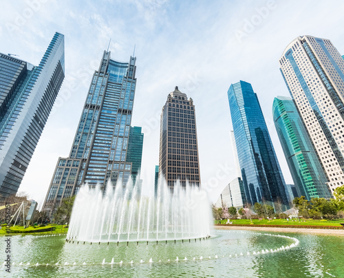 city fountain with modern buildings