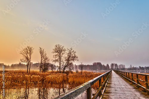 Endless bridge in the rays of dawn © aleluk