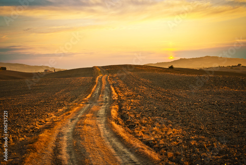 road in tuscany fields