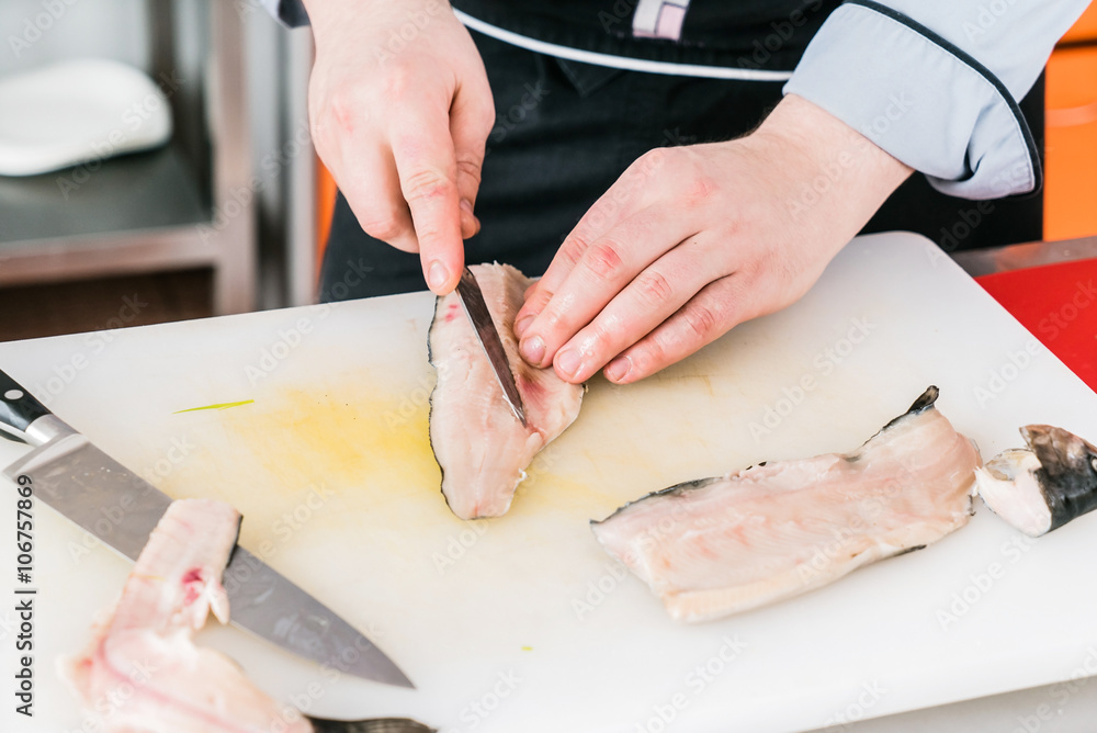 chef cutting fish