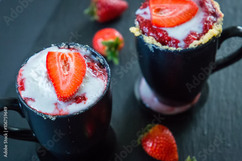 Victoria Sponge Cake in a Mug Prepared in Microwave, Close-up photo