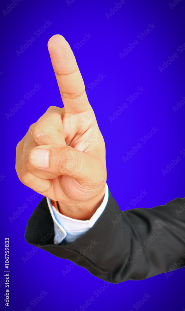Business man showing gesture pointing something on blue background Business man showing gesture pointing something on blue background