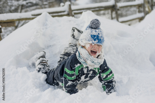 Germany, Bavaria, Berchtesgadener Land, happy boy in winter landscape