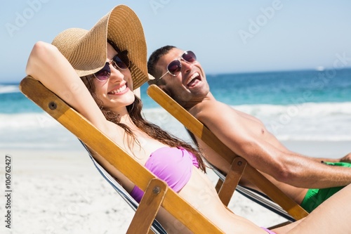 Couple relaxing on deck chair