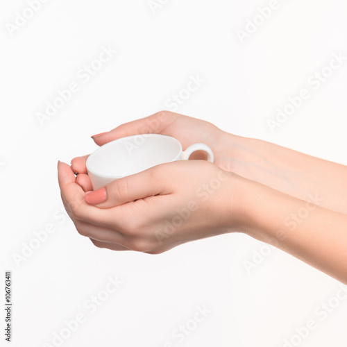 Woman hand with cup on white background