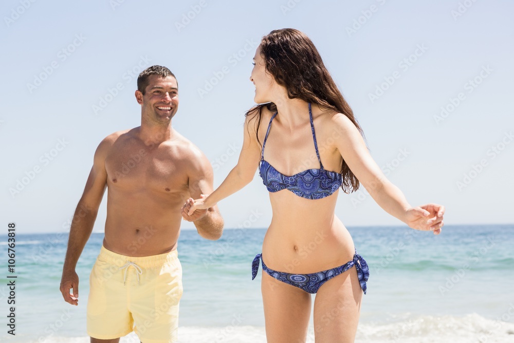 Couple holding hands at the beach Couple holding hands at the beach