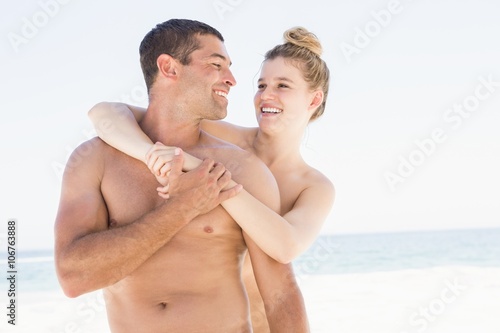 Smiling couple embracing on the beach © WavebreakmediaMicro