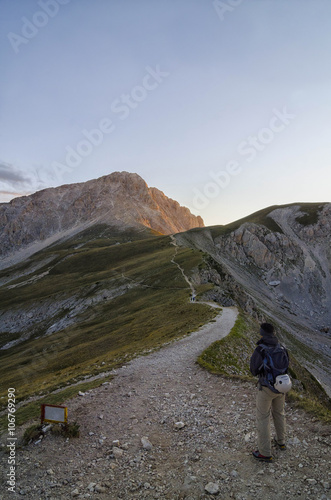 Italy, Abruzzo, Gran Sasso e Monti della Laga National Park, Hiker on the track to summit of Corno Grande photo