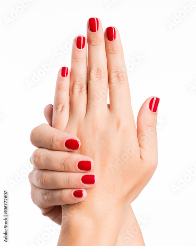 Closeup photo of a female hands with red nails
