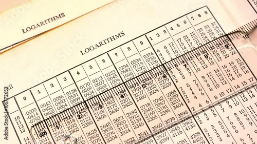 Close up of old logarithm tables. Looking at logarithm tables to make mathematical calculations.