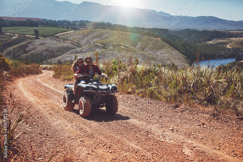 Young couple enjoying off road vehicle ride