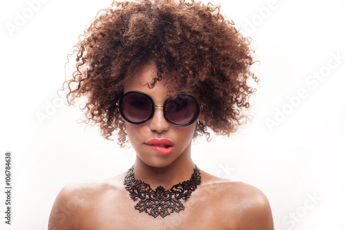 Young girl with afro posing.