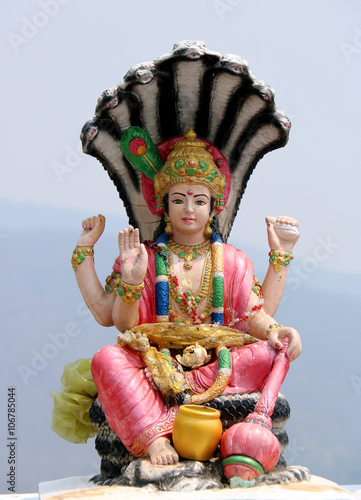 Lord Vishnu statue in a sitting position.