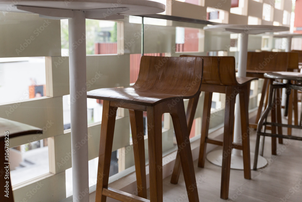 metal and wooden stool with round table at the balcony metal and wooden stool with round table at the balcony