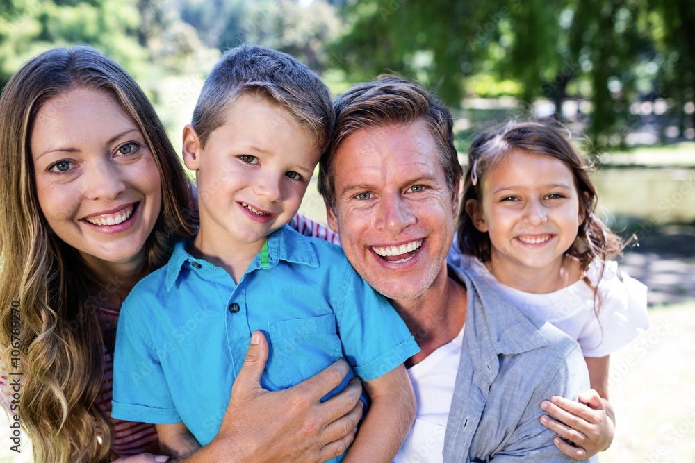 Portrait of a happy family in the park Portrait of a happy family in the park