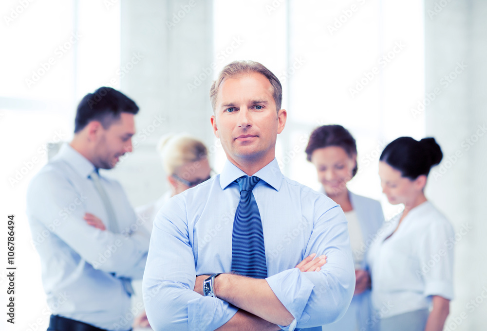 handsome businessman with team in office handsome businessman with team in office