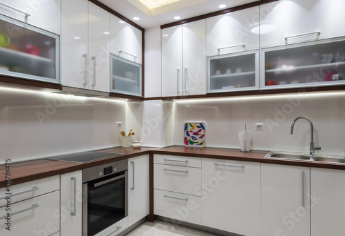 Big white kitchen in modern apartment