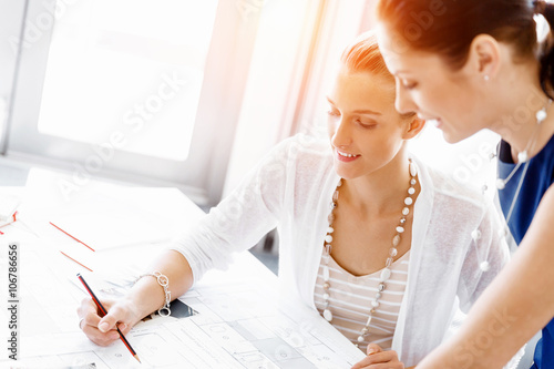 Two female colleagues in office