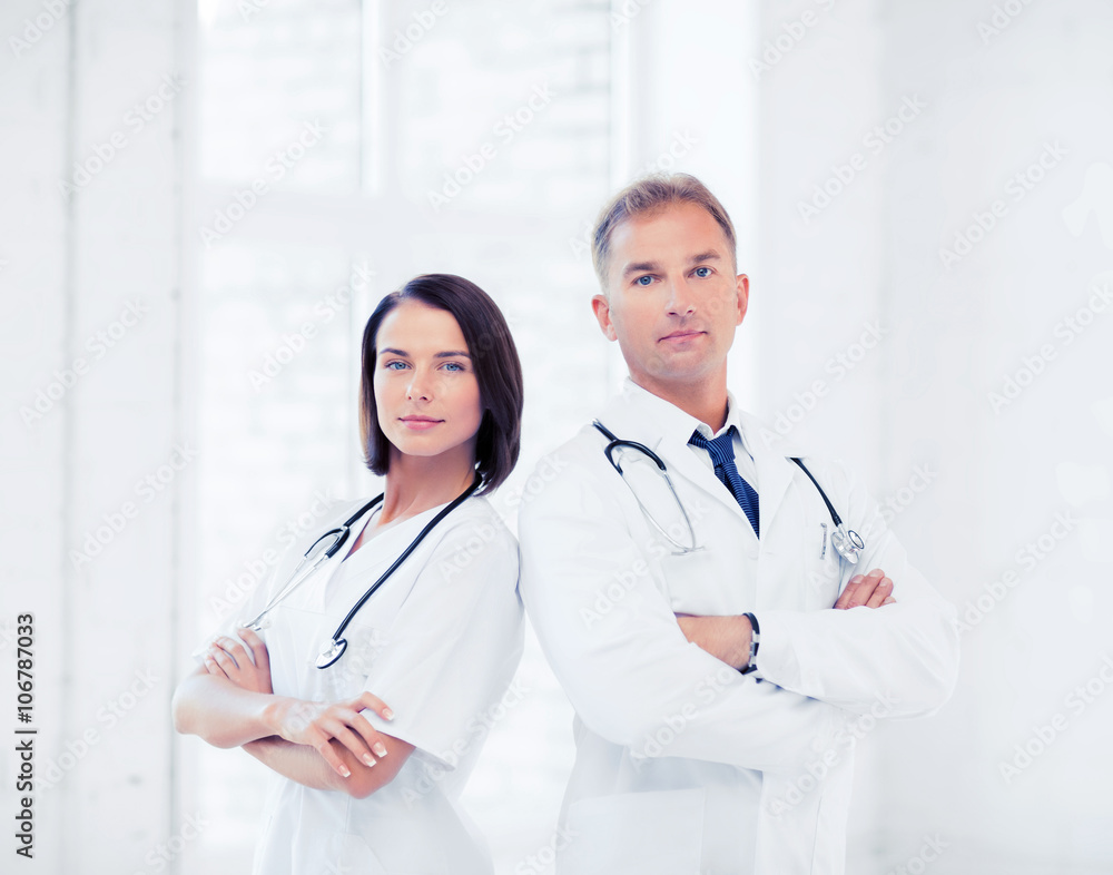 two doctors with stethoscopes two doctors with stethoscopes