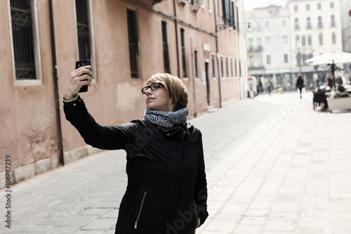 Traveling around the world. Making selfie.