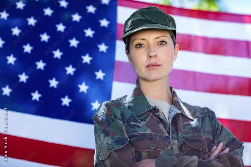 Soldier standing in front of american flag Soldier standing in front of american flag