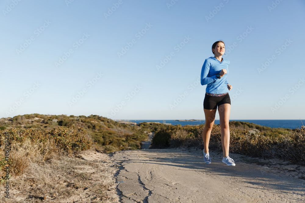 Sport runner jogging on beach working out