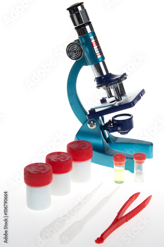 Research microscope, test tubes isolated on white