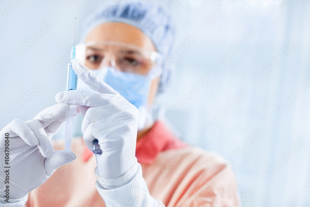 Female surgeon holding anesthesia Female surgeon holding anesthesia
