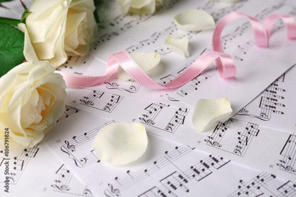 Beautiful rose on music sheets background Beautiful rose on music sheets background