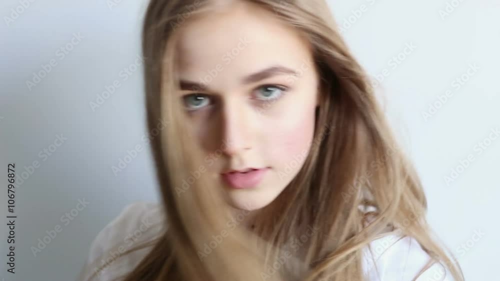 beautiful sexy young girl posing in the studio on a white background beautiful sexy young girl posing in the studio on a white background