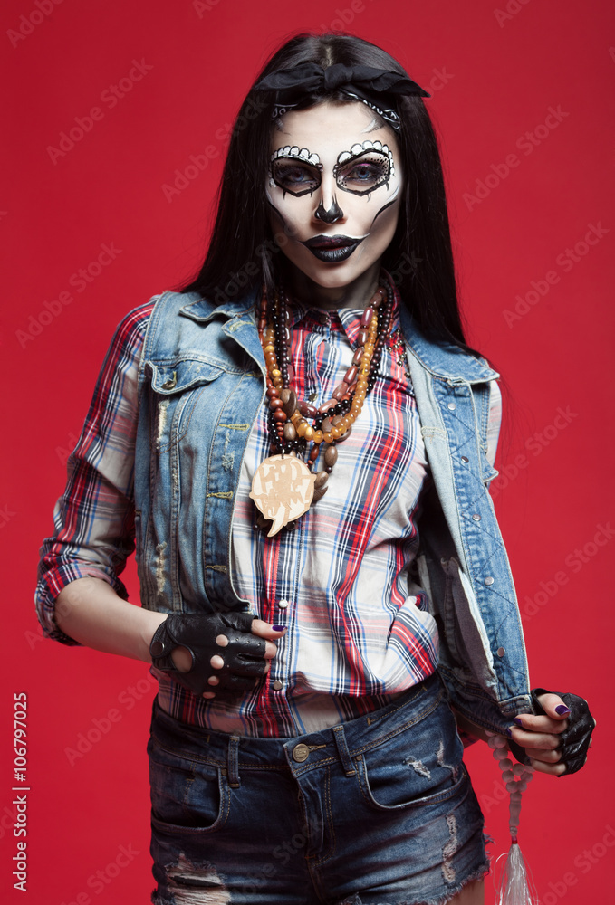 Beautiful sexy brunette model woman.Look zombie. Creative make up. Helloween concept. On red background Beautiful sexy brunette model woman.Look zombie. Creative make up. Helloween concept. On red background