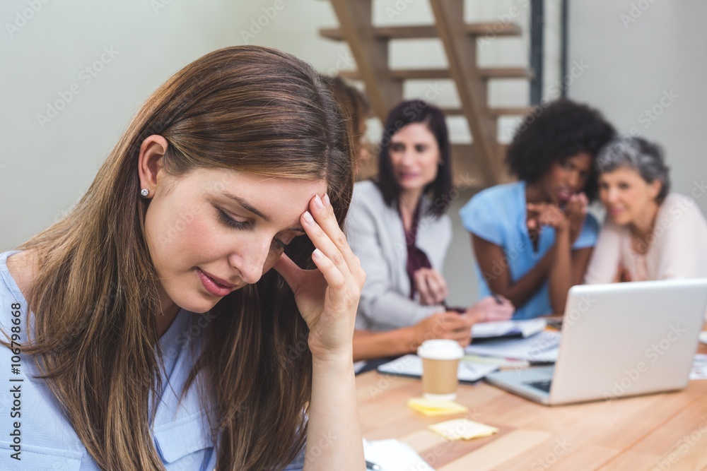 Tense businesswoman sitting in office Tense businesswoman sitting in office