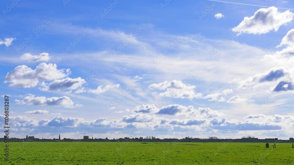 City of Groningen in The Netherlands seen from countryside with skyline and windmill
City of Groningen in The Netherlands seen from countryside with skyline and windmill