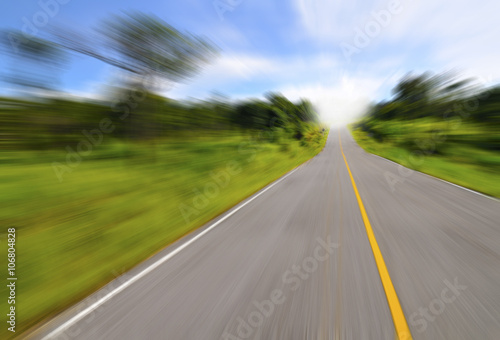 Country road with motion blur under blue sky © leelana