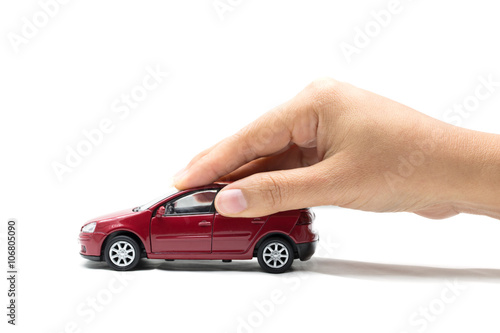Hand with red car on a white background