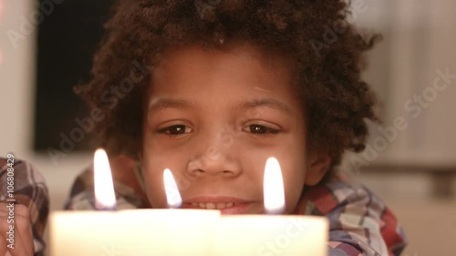 Wallpaper Mural Smiling boy looks at candle. Torontodigital.ca
