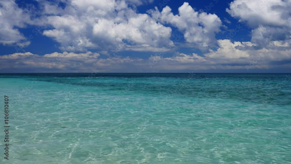 Amazing view of the tropical sea and deep blue cloudy sky in UHD Amazing view of the tropical sea and deep blue cloudy sky in UHD