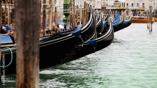 Gondolas rocking on the waves on the main 