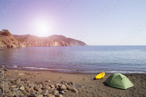 Camping on the beach.Kayak on the beach on a sunny day.